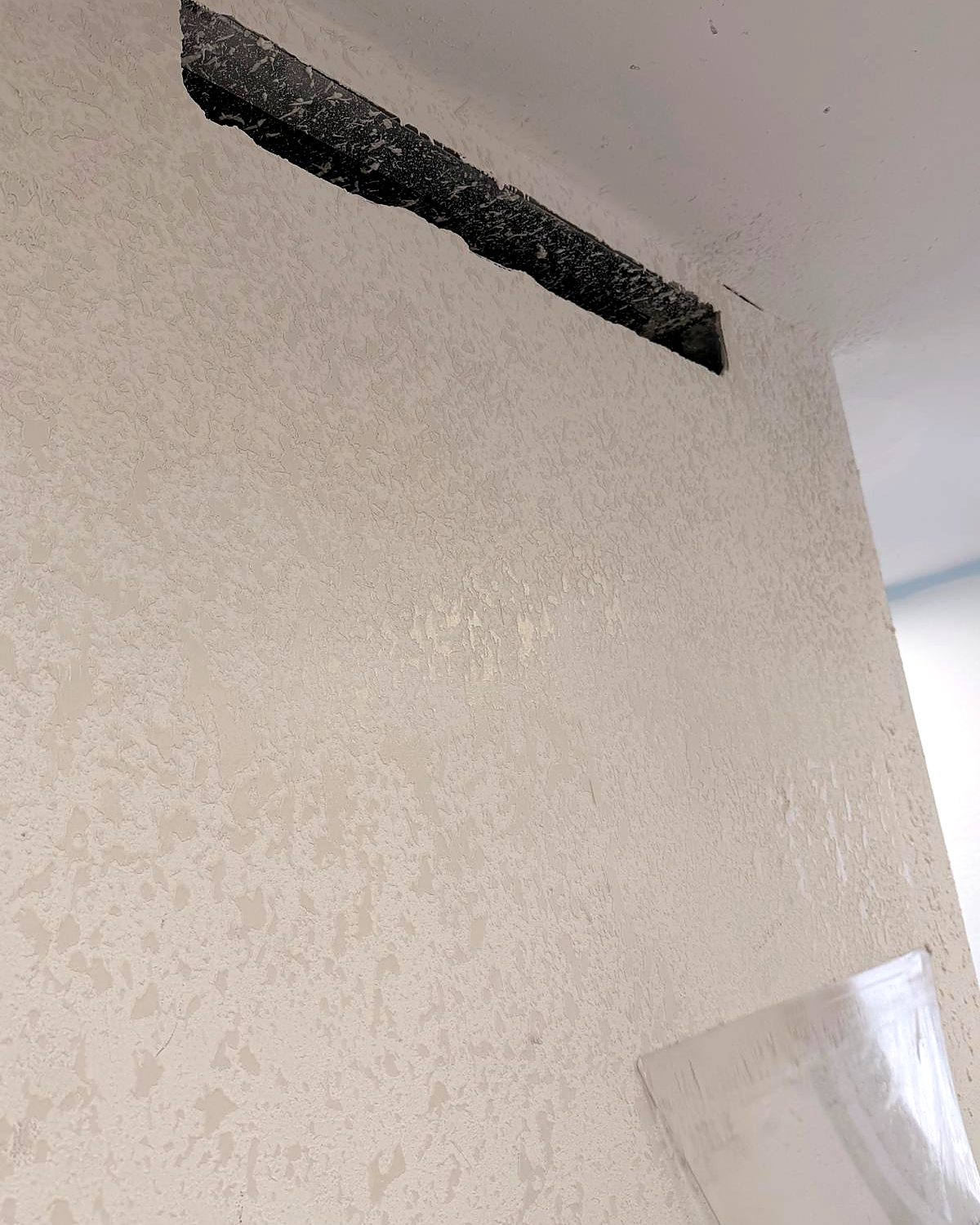 Popcorn ceiling being removed — before renovation in Miami